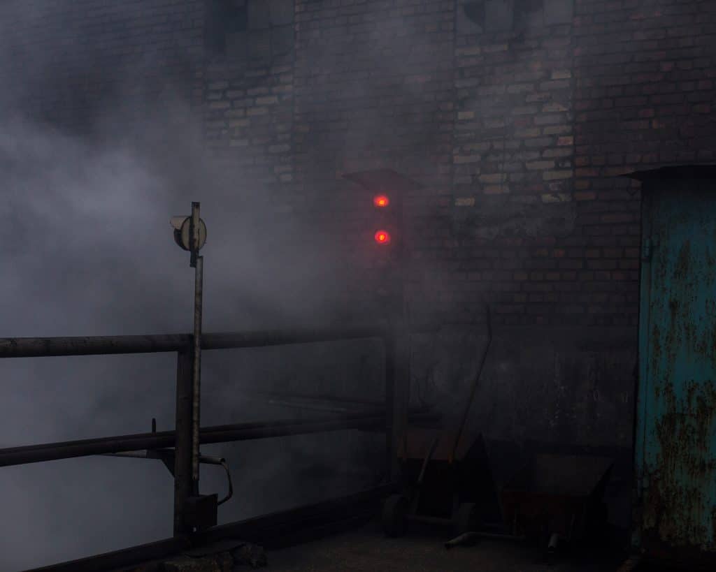 Signal fires in the Avdiivka distilled coal plant, a few kilometers from the front line in eastern Ukraine's Donbass region. © Rafael Yaghobzadeh