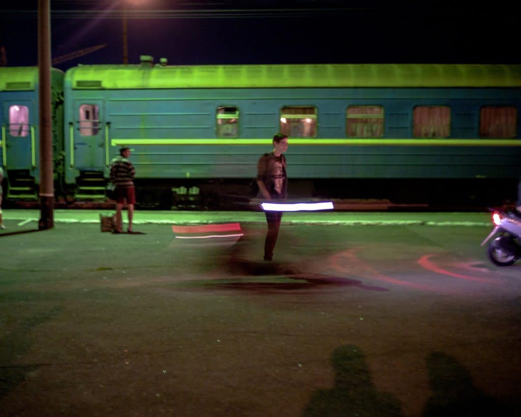 A young Ukrainian man on the platform of the Izmail train station, in southwestern Ukraine. © Rafael Yaghobzadeh