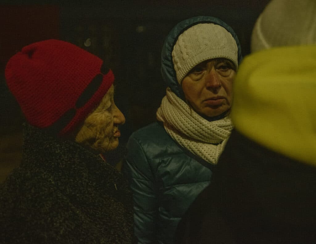 Ukrainian people talking at the border between Slovakia and Ukraine. March 8, 2022 © Ismail Ferdous / Agence VU' for Blind