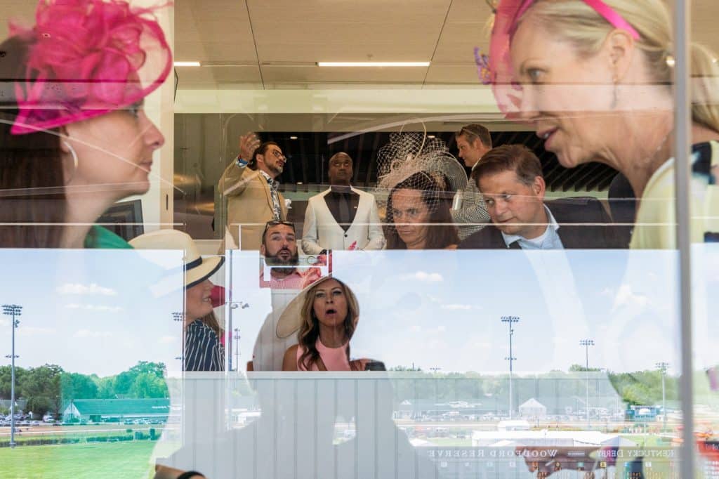 “Millionaire’s Row” at the Kentucky Derby. My friend Christian had met a keen bettor who had invited us to hear a hot tip. The previous year we had earned almost 20 times our bet on his advice, and we were eager for his insights. We were slightly rumpled looking for the rarefied environment, but managed to gain entrance with our press badges. We met up with the tipster, who gave us a complicated betting scheme, handed us each a crisp $100 bill, and sat back down to continue his conversation. Undeterred by the simultaneous strangeness and generosity of the interaction, we placed the bets. We lost. Discouraged, we began taking photos of the nattily dressed guests in the boxes, but were kicked out moments later by annoyed security guards. Louisville, Kentucky. USA. 2021. © Peter van Agtmael