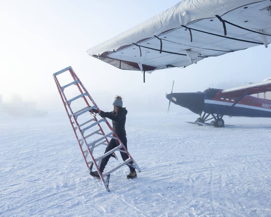 As a midwinter fog settles over the airport, signaling the end of the workday, glacier pilot Leighan Falley has put wing covers on a Turbine Otter. Falley, who spent nine years guiding climbers on Denali, flies for Talkeetna Air Taxi in the Alaska Range. “I think that the aviator of today has very little to do with the pilots that flew and crashed a bunch of airplanes in the 60s, 70s, even 80s. As modern aviators, we are more cognizant of target risk, we have better equipment.” © Acacia Johnson Winner of the 2021 Canon Female Photojournalist Grant