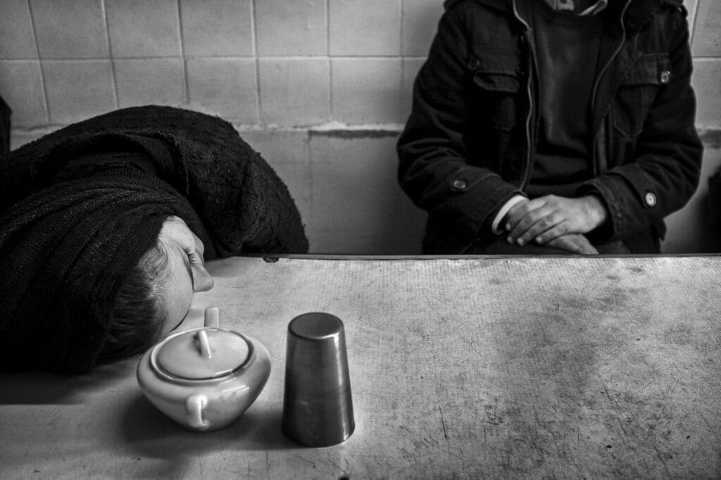 Love is hard when you can't touch.  Two friends sit in a traditional restaurant waiting for their order in Tabriz, Iran, December 1, 2014. © Farshid Tighehsaz