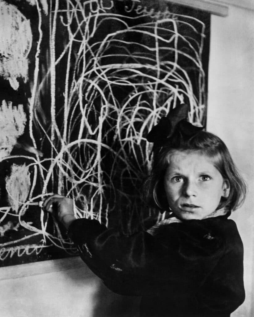 Tereska, a child at a school for traumatized children, is asked to draw a home. Warsaw, 1948. ©David Seymour-Magnum Photos