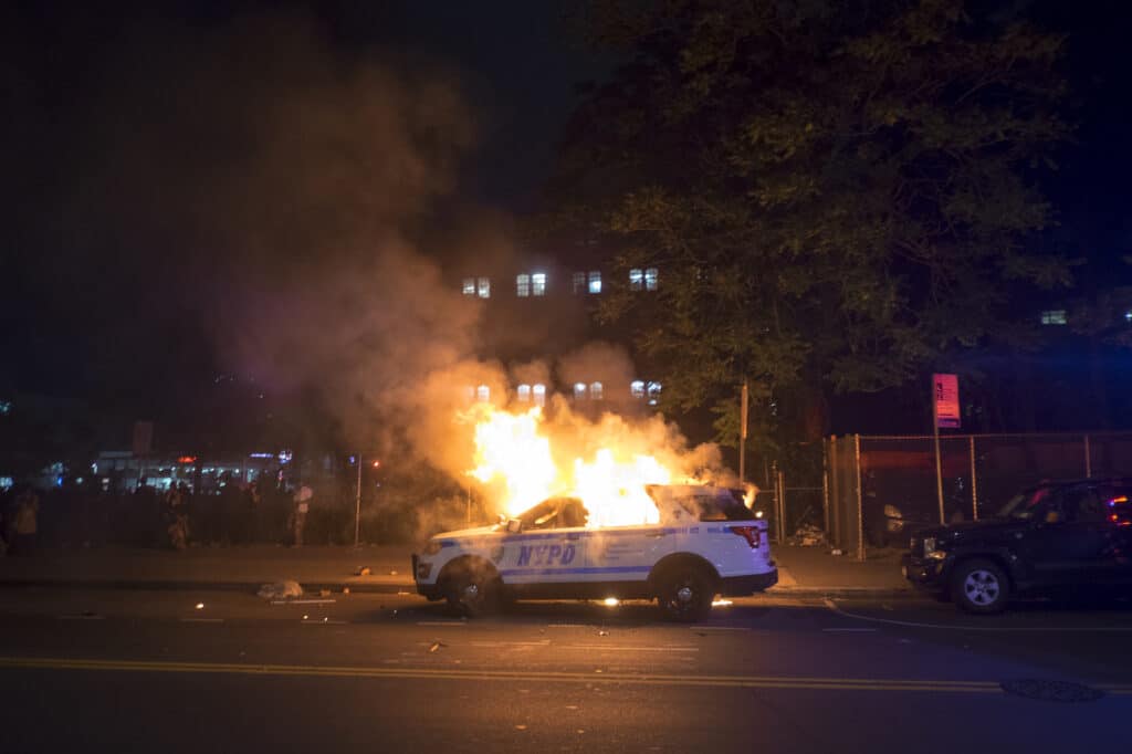 The killing in Minneapolis, MN of George Floyd, who was black, by a white police officer last week has touched off nationwide protests. Several hundred demonstrators and police clashed for hours on Saturday evening in the Flatbush neighborhood of Brooklyn, along Bedford and Church Avenues. At least two police cars and several garbage dumpsters were burned and dozens of pepper spray use incidents and arrests ensued. Brooklyn, New York, May 30, 2020. © Alan Chin