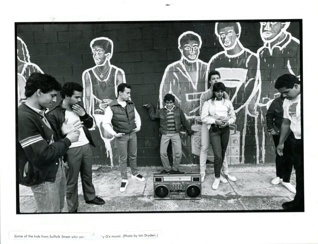 Some of the kids from Suffolk Street posing in front of Bobby G's mural on Delancey Street, 1984. Photo by Ian Dryden.