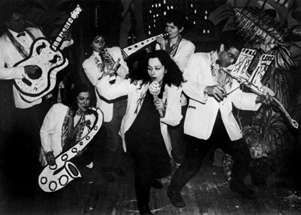 Publicity photo of the Cardboard Air Band at No Rio. From left to right, Walter Robinson, Ellen Cooper, Bebe Smith, Kiki Smith, Christy Rupp and Bobby G, 1981.