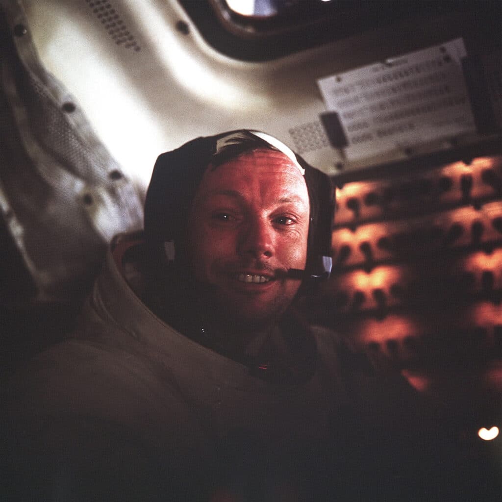 July 21, 1969, Hasselblad 70 mm. Lens 80 mm, F/2.8. One of the most beautiful portraits of the Apollo program. Buzz Aldrin captures a tired, but delighted Neil Armstrong after returning to the relative safety of the lunar module Eagle at the end of their historic walk on the Moon. It is believed that the dry air, the changes of pressure, the irritation due to the lunar dust and the exhaustion, simply, contributed to give him these red and watery eyes by Buzz Aldrin ref NASA : AS11-37-5528. © NASA_JSC_ASU_Andy Saunders