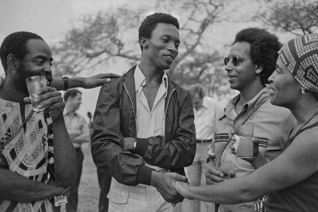 Reception at US Ambassador's residence: David Stephens, Oghenero Akpomuje, Frank Smith and Valerie Maynard, 1977 © Marilyn Nance / Artists Rights Society (ARS), New York