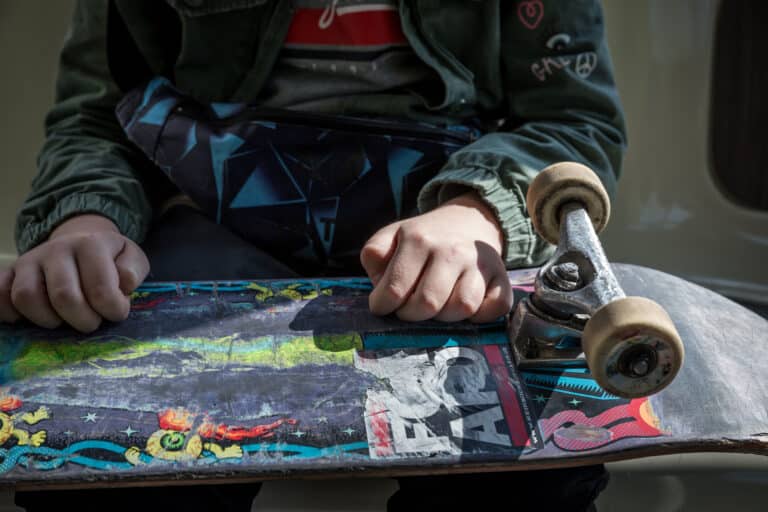 Close-up of Svyatoslav’s hands on a used skateboard. Hanover, Germany. April 27th, 2022. © Thomas Girondel