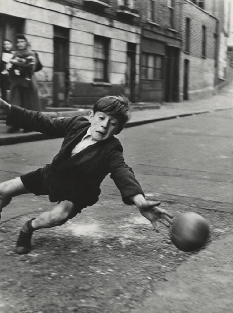 Goalie, Brindley Road, Paddington, London, 1956 Vintage gelatin silver print. 23 1/16 x 17 3/16 in. (58.6 x 43.7 cm) 8282. © Roger Mayne