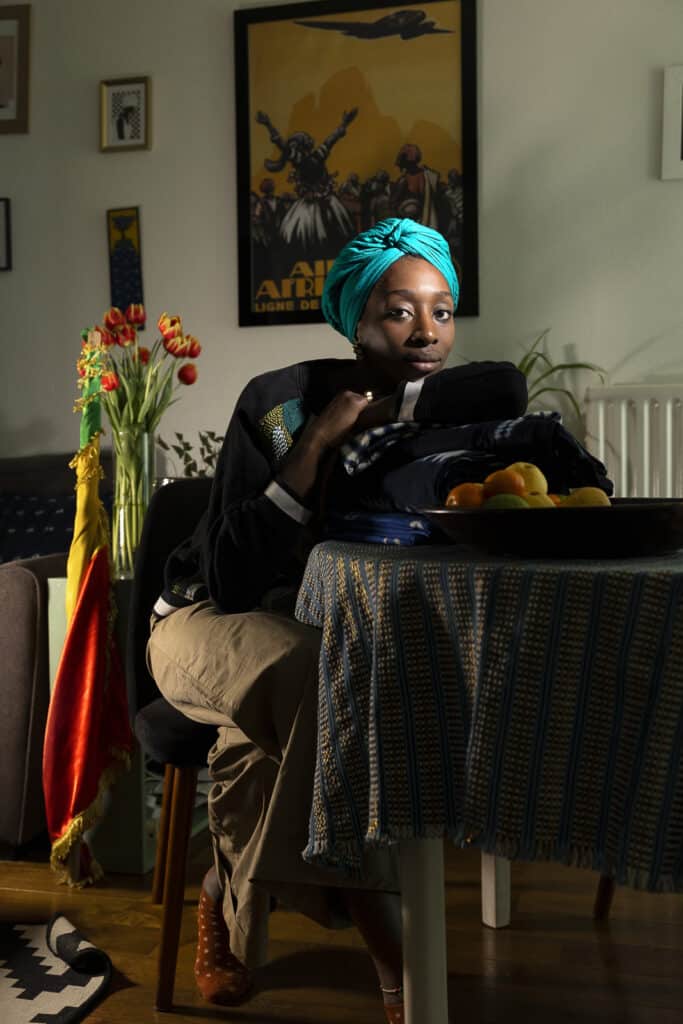 Koudiedji Sylla, 27 years old, film director and journalist at her home in Champs sur Marne, Ile de France. Coming from a traditional and respected Malian family Koudiedji had the chance to be supported by her mother and sisters when decided to marry a white french man. For many african-french women of first generation this would be impossible to think or a reason of breaking up with them. © Carolina Arantes