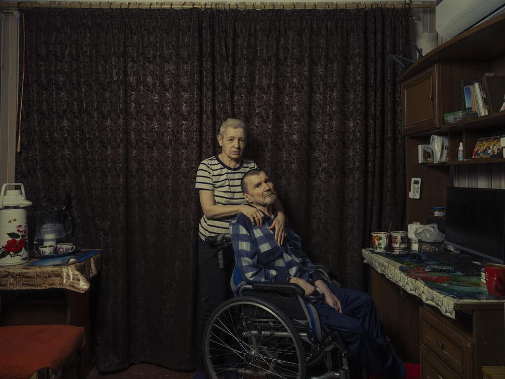 Volodymyr Skabelka,70 (in wheelchair), and Alla Zellena, 66 in their apartment in Bakhmut, Ukraine on September 7, 2022 © Sasha Maslov I Institute