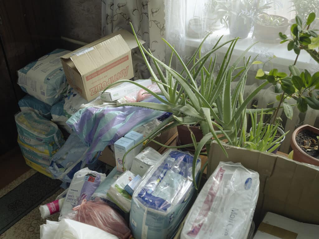 Various supplies for tthe disabled comunity of Bakhmut at Olena Bondarenko's bedroom, Bakhmut, Ukraine on September 7, 2022 © Sasha Maslov I Institute