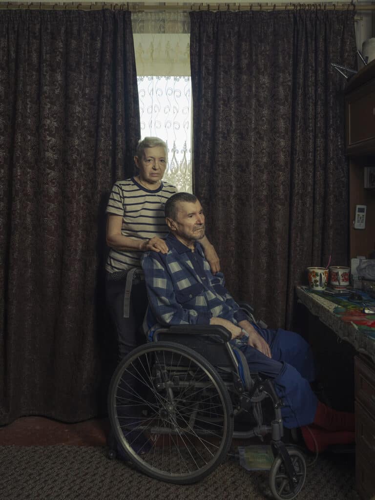 Volodymyr Skabelka,70 (in wheelchair), and Alla Zellena, 66 in their apartment in Bakhmut, Ukraine on September 7, 2022 © Sasha Maslov I Institute