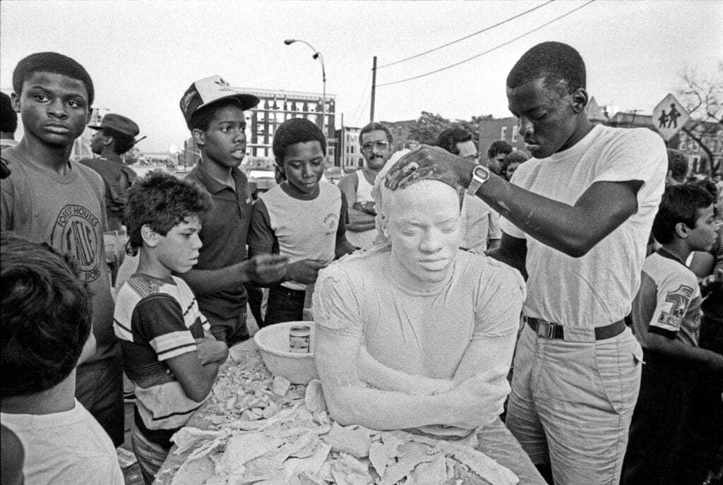 Al Sheridan with his cast at Dawson Street, Bronx with friends, 1983. Photo by Martha Cooper.