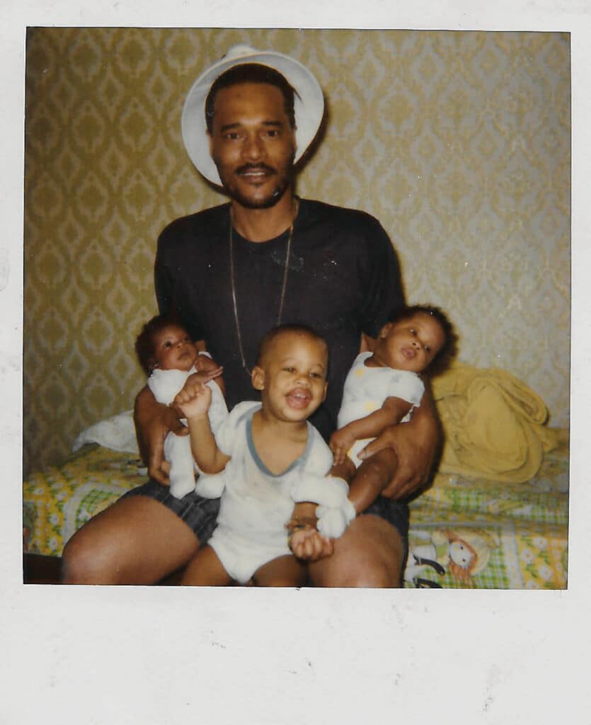 Samuel Johnson holding his grandchildren Shanice, George, and Shernelle. © Ten Speed Press/Penguin Random House