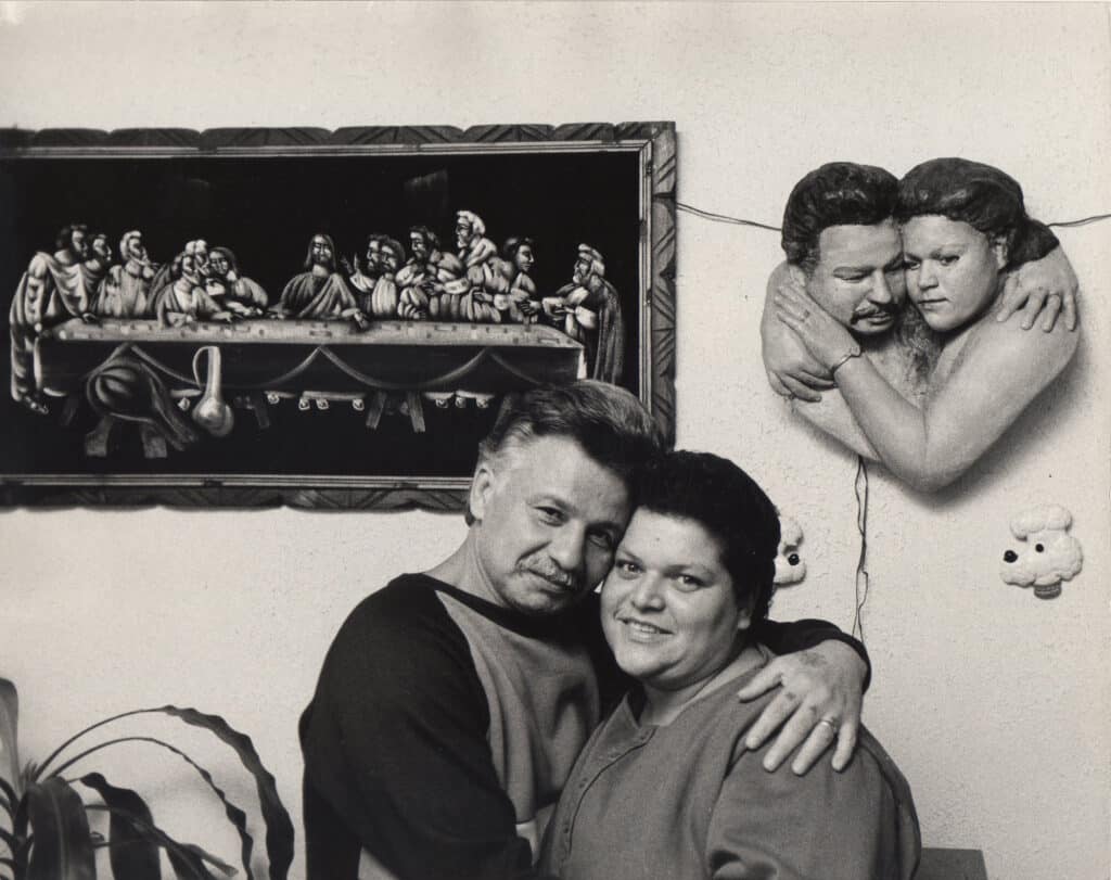 Luis and Virginia Arroyo at home with their portrait, Walton Avenue, Bronx, 1986. Photo by Ivan