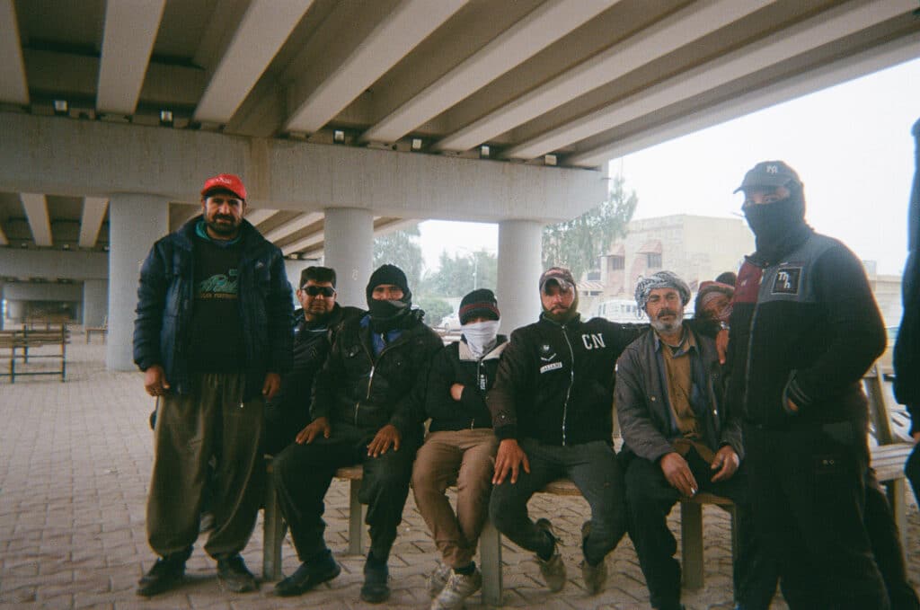 Construction workers gathered under the bridge © Omer Nawfel, Fallujah