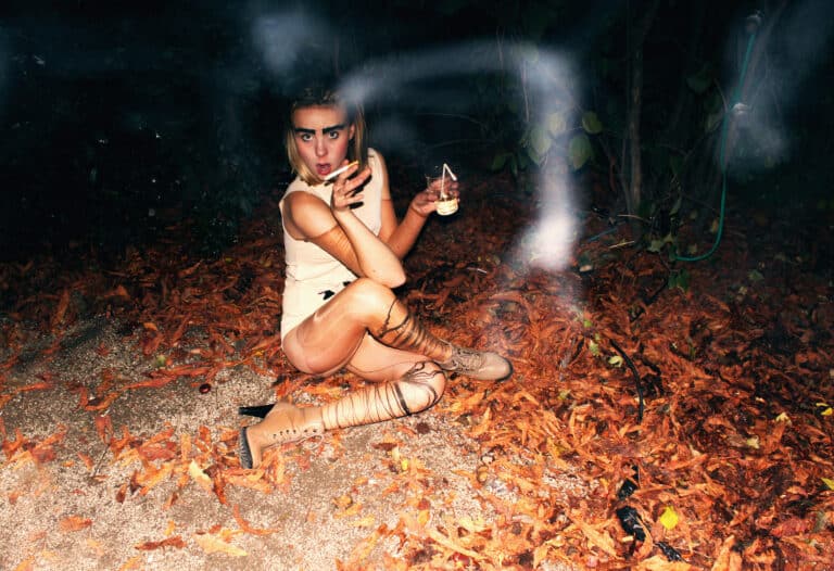 Alice smoking on the ground, 2010