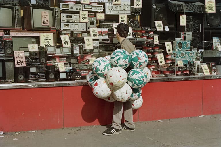 Balloons on Delancey Street, 1986. From the series Loisaida Street Work-1984 to 1990. Photographs from New York's Lower East Side.