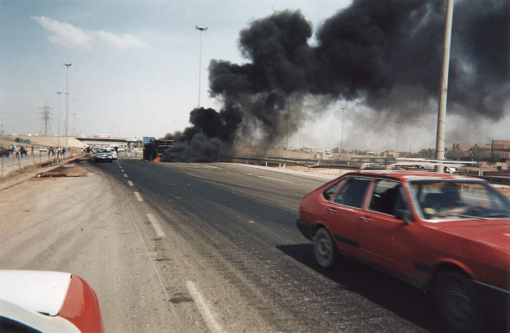 “An exploded military vehicle on the highway near Falluja” © Jassim Mohommad