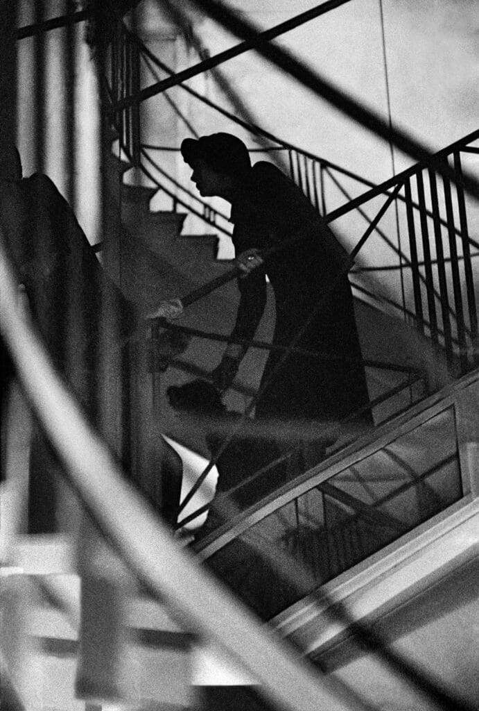 Coco Chanel, fashion designer, watching her fashion show, 1958, Paris, France. © Frank Horvat