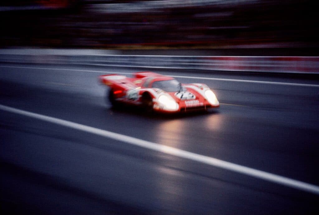 Viewing his subjects with an artist’s eye, Joe Honda used blur effects to make his photographs appear like paintings. Here a Porsche 917 car melds with the night of the legendary 24-hour race.