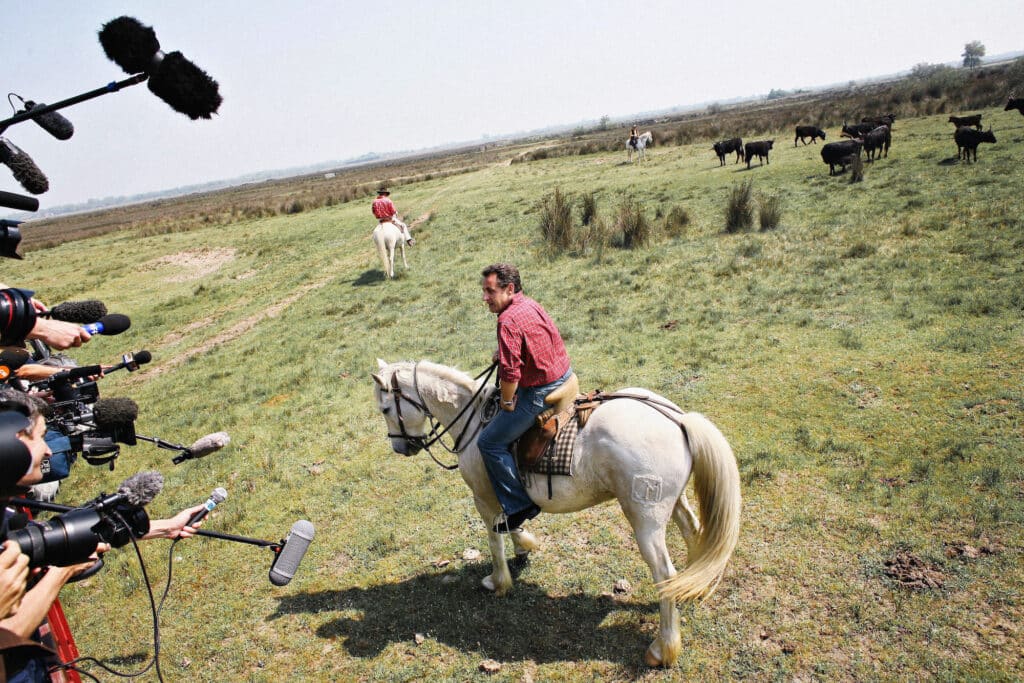 Nicolas Sarkozy during a presidential campaign, visiting a manade in the Camargue, Saintes-Maries-de-la-Mer, April 20, 2007. Courtesy of the Estate of the photographer. © Laurent Troude