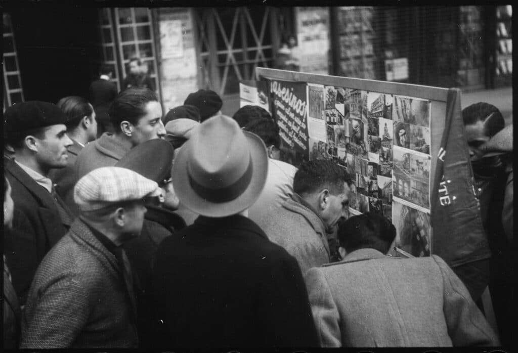 Republican propaganda in the streets of Barcelona denouncing Franco's bombings, 1937 © Arxiu Campañà