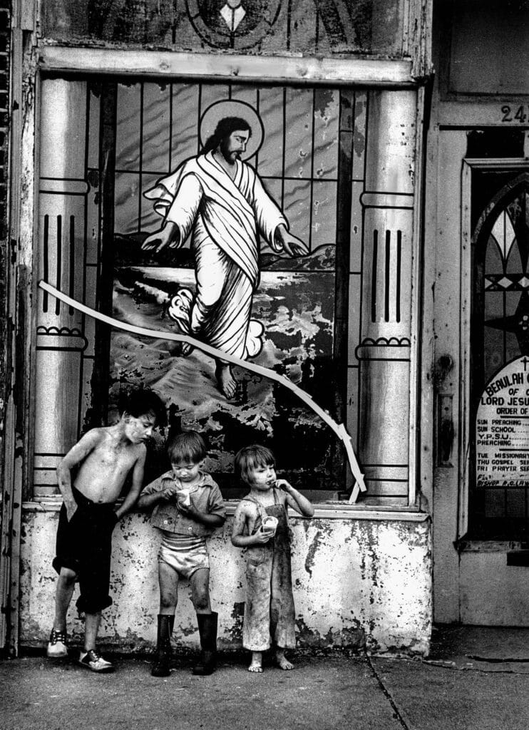 Broken Christ With Children, Coney Island, 1950 © Harold Feinstein