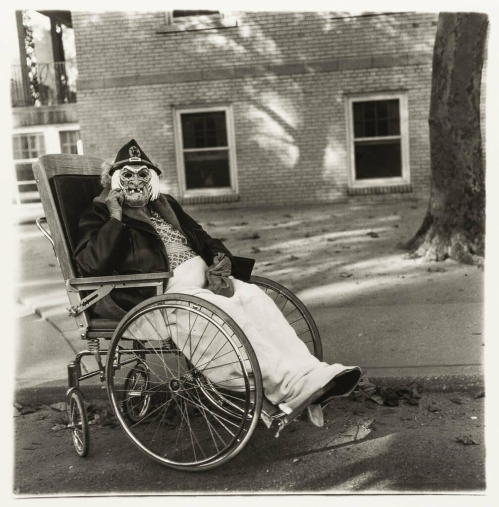 Masked woman in a wheelchair, Pa. 1970 © The Estate of Diane Arbus Collection Maja Hoffmann / LUMA Foundation