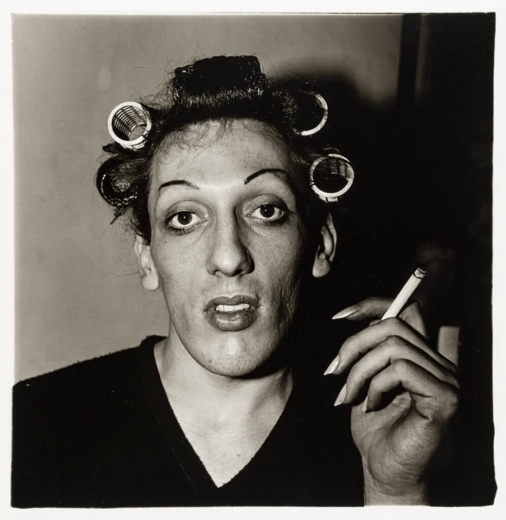 A young man in curlers at home on West 20th Street, N.Y.C. 1966 © The Estate of Diane Arbus Collection Maja Hoffmann / LUMA Foundation
