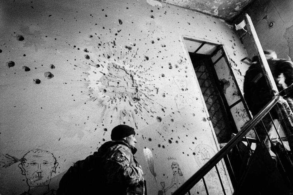 January 03, 2018, Mariynka, Ukraine,a soldier accesses the roof of a hospital destroyed by shelling to set up his observation post. Edouard ELIAS, Ukraine