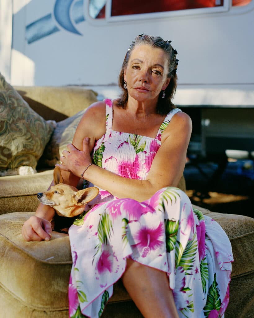 Mary McEllroy, Feather West Travel Trailer. Mary has been waiting 3 years for compensation from Pacific Gas & Electric following the loss of her trailer in the Camp Fire megafire in 2018. Unemployed since then, she has lived in her car for 2 1/2 years and has just moved into this motorhome with her sister. July 2021, Paradise series © Maxime RICHE