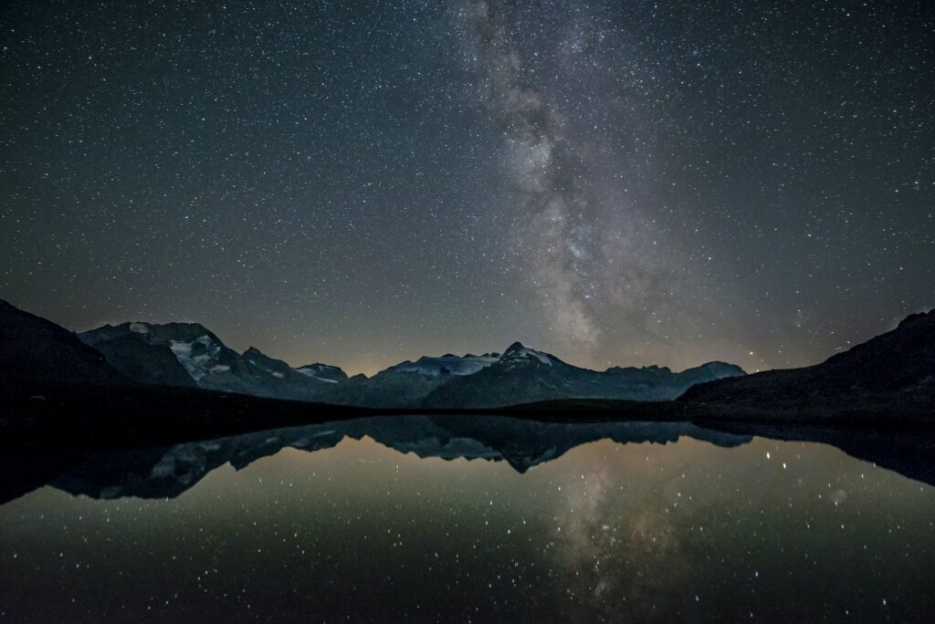 A mountain lake provides a beautiful foreground for a Milky Way photo © Eberhard Grossgasteiger / Unsplash Taken with a Canon EOS 70D: 14.0 mm, ƒ/2.8, 20sec, ISO 800 in the Zillertal Alps in Italy