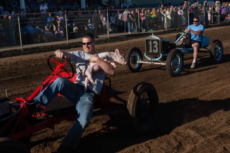 Men compete in the annual Pig-N-Ford Races at the Tillamook County Fair in Tillamook, Ore. There were two semi-final races on 8/11/07, followed by the World Championship race. Log Riding during Onbashira, Lower Shrine (Shimosuwa) © Sol Neelman