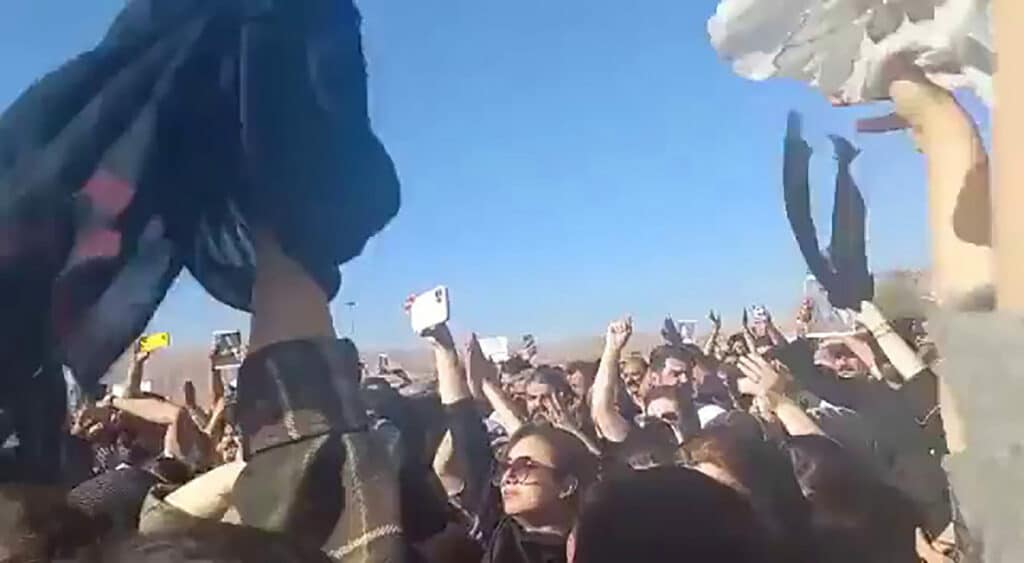 A funeral protest for Mahsa Amini. Women removed their headscarves, the crowd chanted “Death to the dictator!” and they launched the catchcry “Woman, Life, Freedom!” that would then be heard at all protests. Saqqez, Kurdistan Province, Iran, September 17, 2022. © Anonymous Photo 