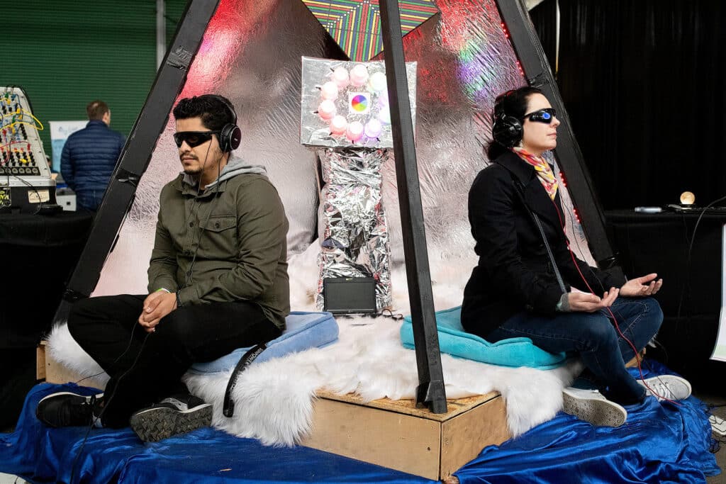 Experiencing the AZoth Pyramid, an interactive brainwave entrainment machine, at the Worlds Fair Nano where the general public can experience the future. San Francisco, California, March 11, 2018. © Laura Morton Winner of the 2022 Pierre & Alexandra Boulat Award