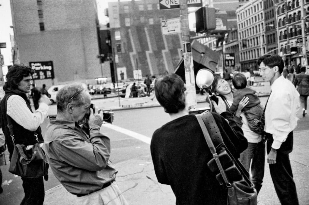 Robert returns to fashion to photograph an Aspesi shirt collection, Astor Place, NYC, 1988 © Brian Graham: Goin’ Down the Road with Robert Frank (2023)