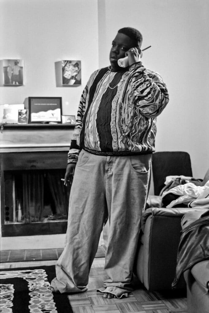 Biggie doin’ business in his Brooklyn apartment. © Peter Spirer