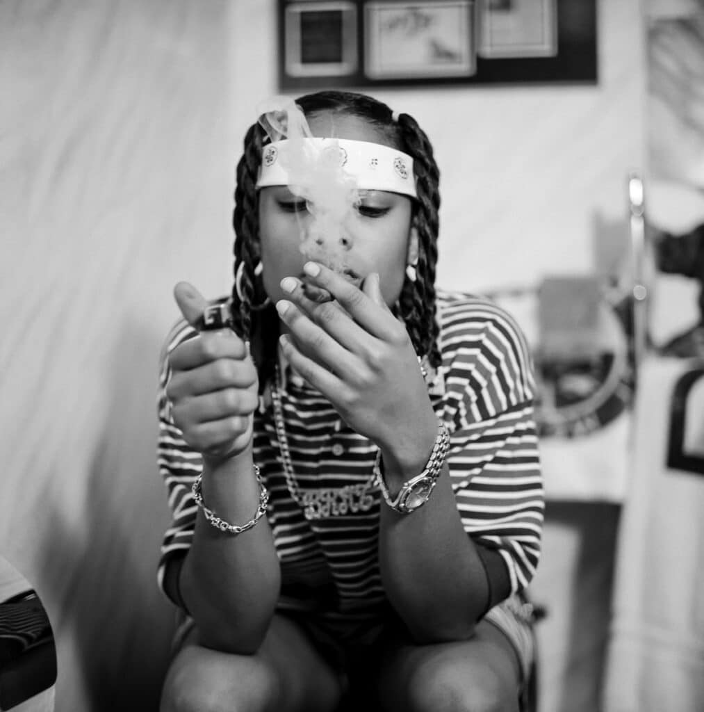 Da Brat at Jermaine Dupri’s Atlanta, Georgia home studio, smoking a blunt on the throne. © Peter Spirer