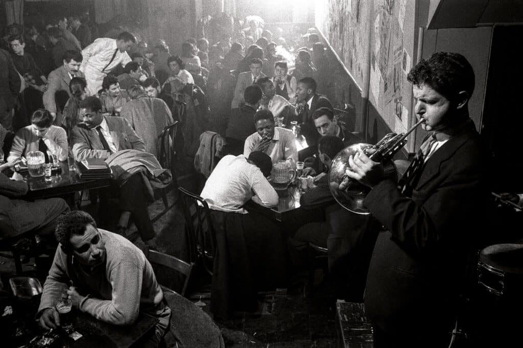 USA. New York City. 1957. David Amram entertains at the Five Spot Cafe.