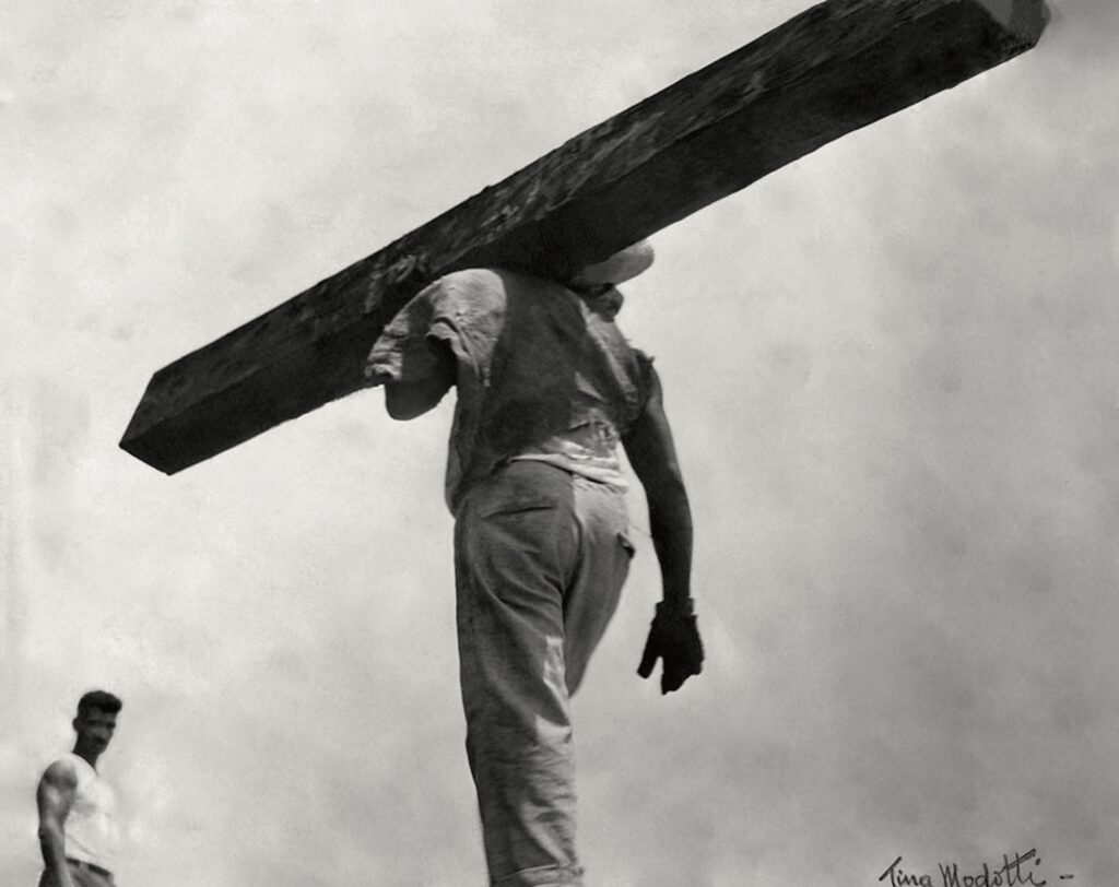 © Tina Modotti, Man Carrying a Beam, 1928, Fundación Televisa Collection and Archives, Mexico City.