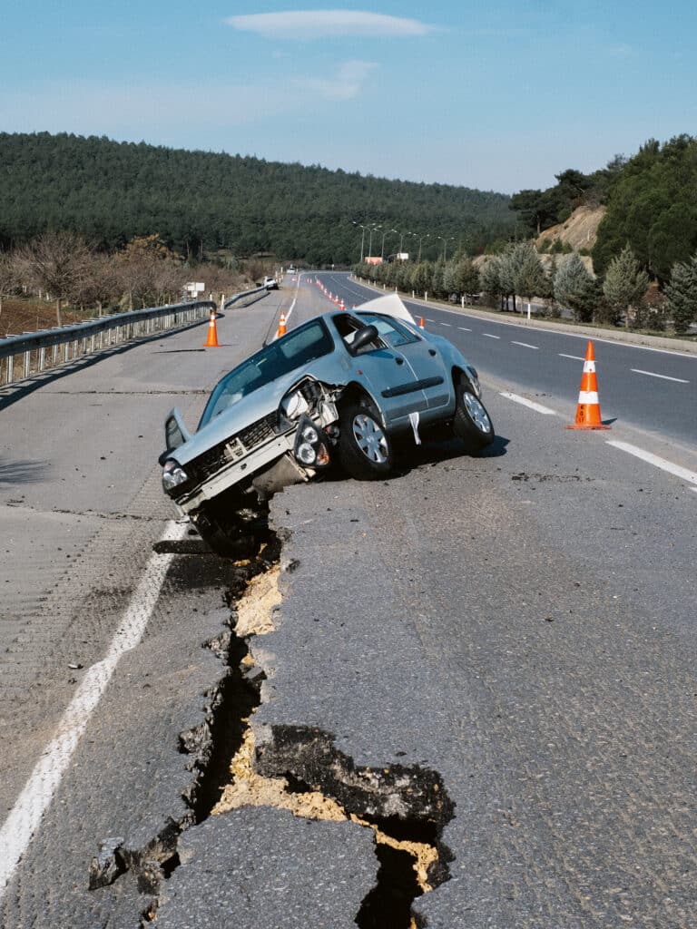 Turkey, Kahramanmaras.Febr 8, 2023. A car seen damaged on the broken highway road during the powerful earthquakes © Emin Özmen