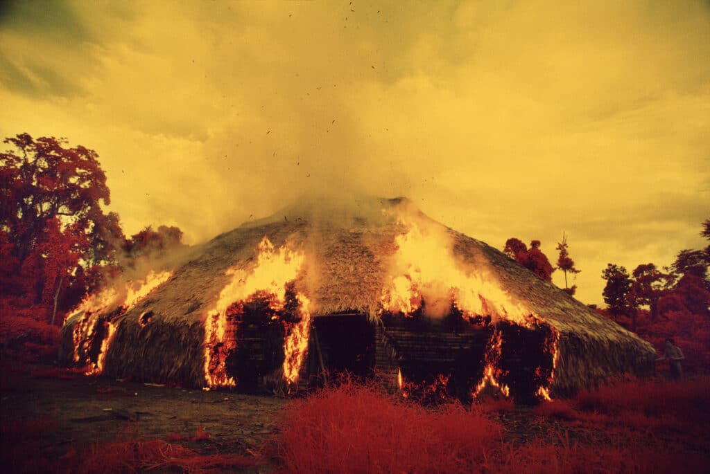 Yanomami hut on fire. Catrimani, Roraima, Brazil, 1972-1976. © Claudia Andujar & The Yanomami Struggle, Claudia Andujar Collection / Moreira Salles Institute